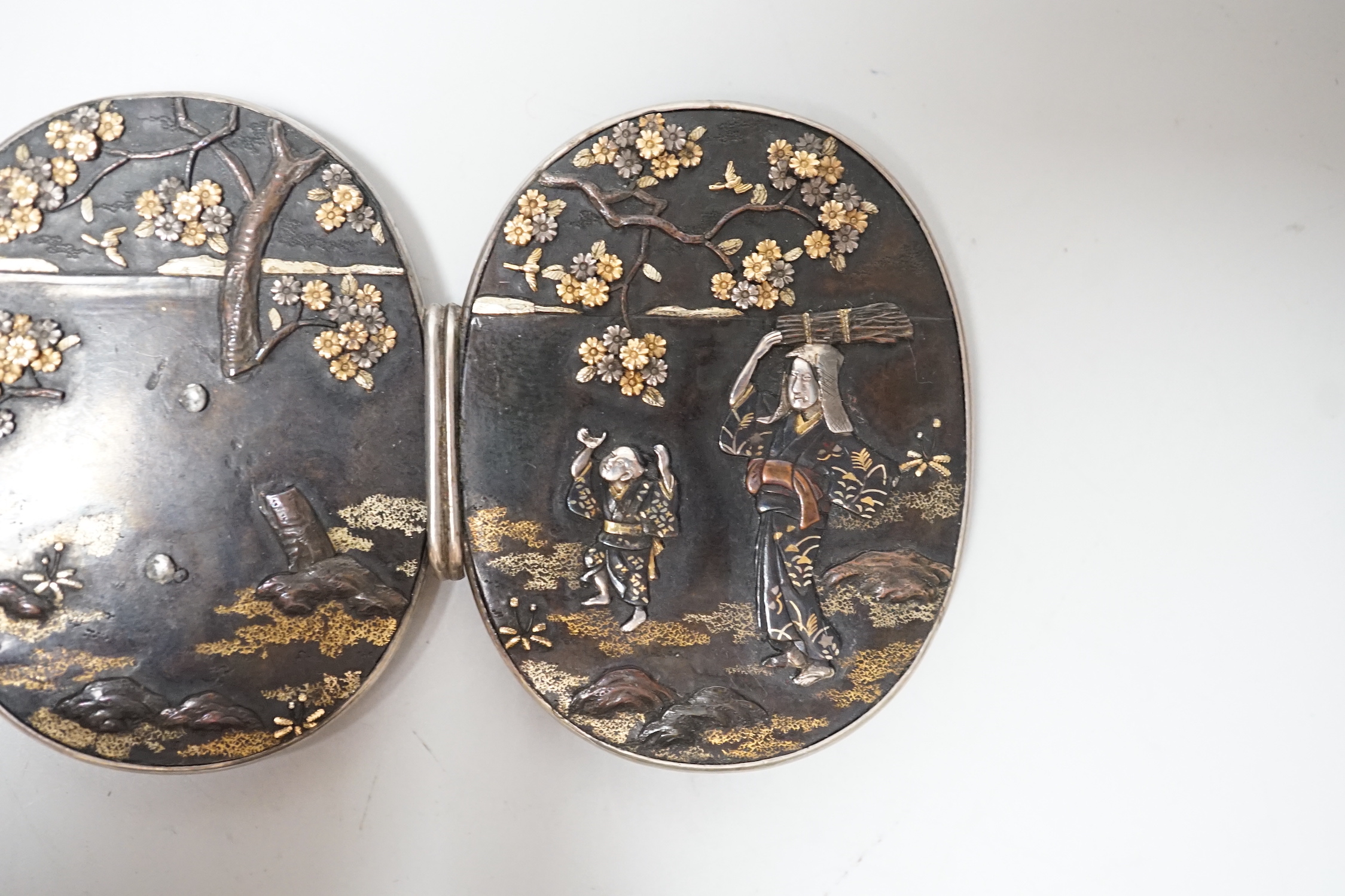 A Japanese Meiji period mixed metal belt buckle